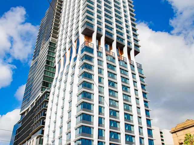 Modern apartment building with balconies exterior at Yugo Adelaide City in Adelaide Student Accommodation