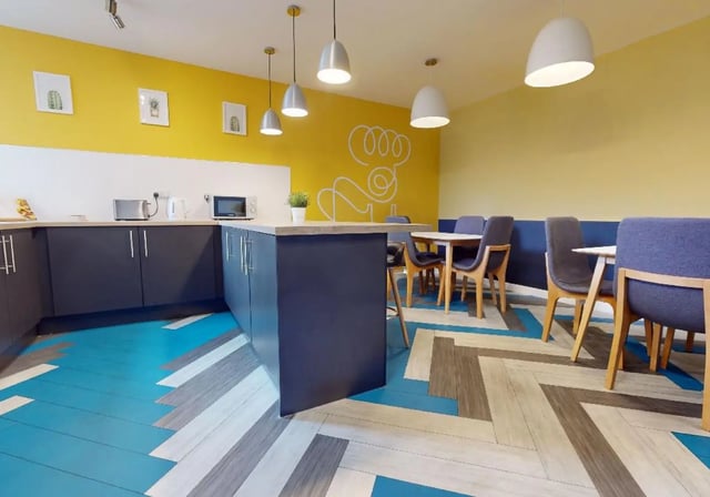 Kitchen with dining area and chairs kitchen at iQ Newland House in Nottingham Student Accommodation