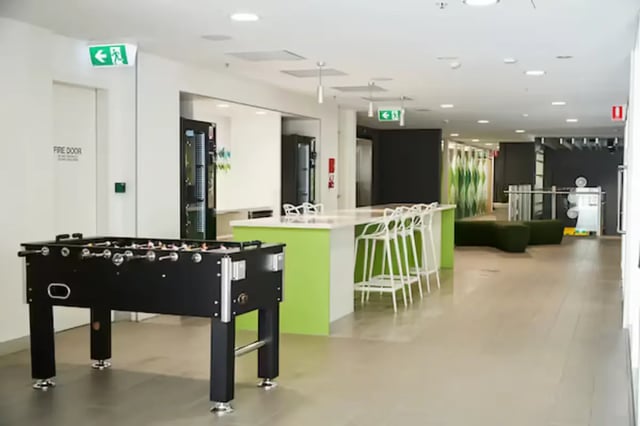 Foosball table, counter with stools, lounge area, Common area at Scape Adelaide Central in Adelaide Student Accommodation