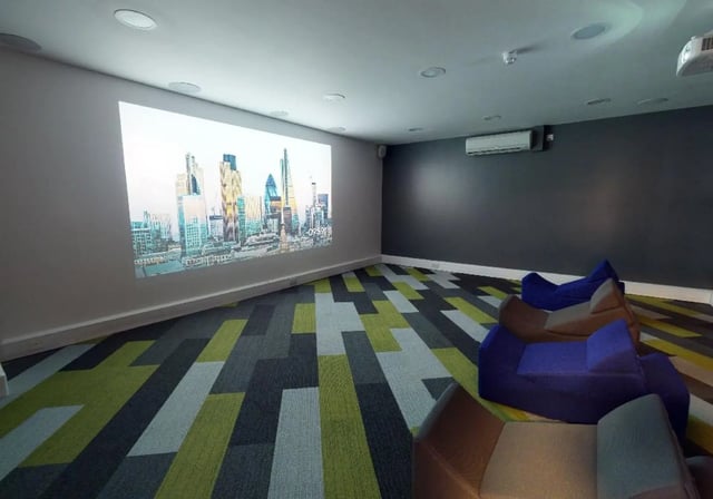 Projected city skyline on wall beanbag chairs living room at iQ Newtown House in Nottingham Student Accommodation