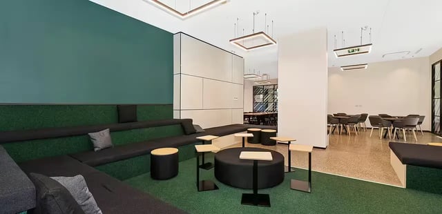 Tiered seating, tables, and chairs communal area at Scape Waymouth in Adelaide Student Accommodation