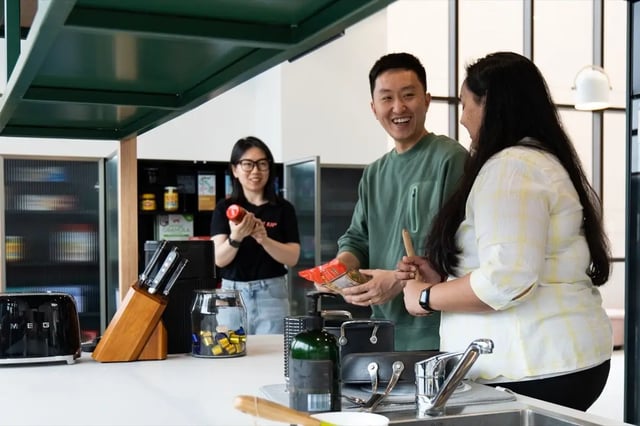 Students cooking in a modern shared kitchen area at The Switch Adelaide in Adelaide Student Accommodation