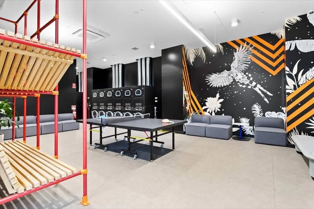 Ping pong table couches laundry machines communal area at The Switch Adelaide in Adelaide Student Accommodation