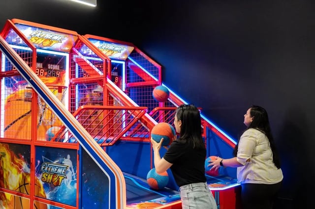 Basketball arcade game with players playing recreation area at The Switch Adelaide in Adelaide Student Accommodation