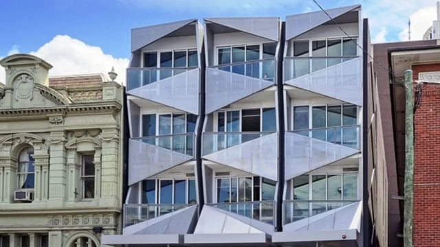 Modern building with balconies and large windows exterior at Student Living - Vivida in Melbourne Student Accommodation