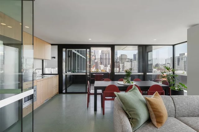 Kitchen dining area and living room with city view at Campus House in Melbourne Student Accommodation