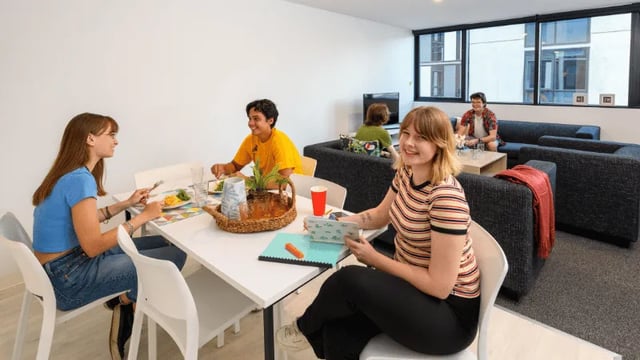 Students dining and relaxing in common area at Unilodge South Bank in Brisbane Student Accommodation