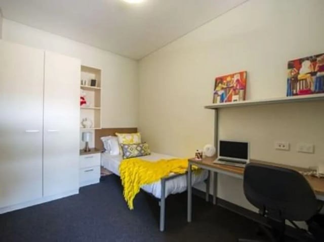 Bed closet desk and chair bedroom at UniLodge @ Metro Adelaide in Adelaide Student Accommodation