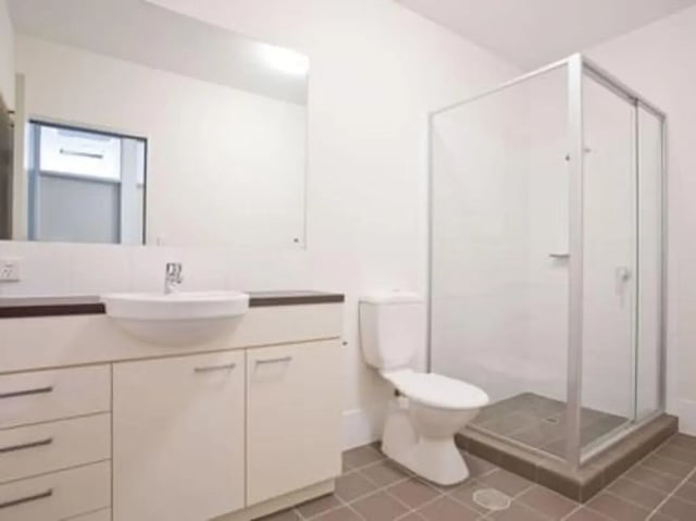 Sink toilet and glass shower enclosure bathroom at UniLodge @ Metro Adelaide in Adelaide Student Accommodation