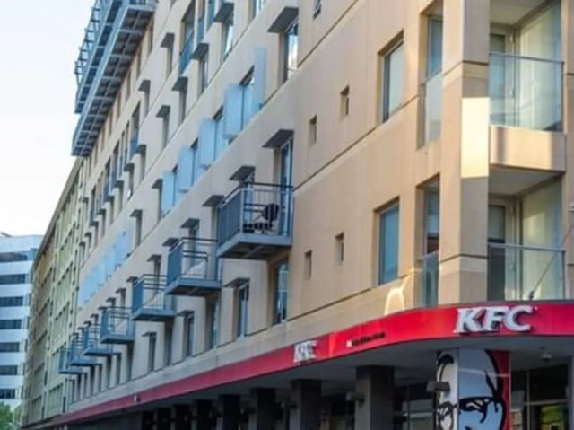 Balconies on beige building with KFC exterior at UniLodge @ Metro Adelaide in Adelaide Student Accommodation