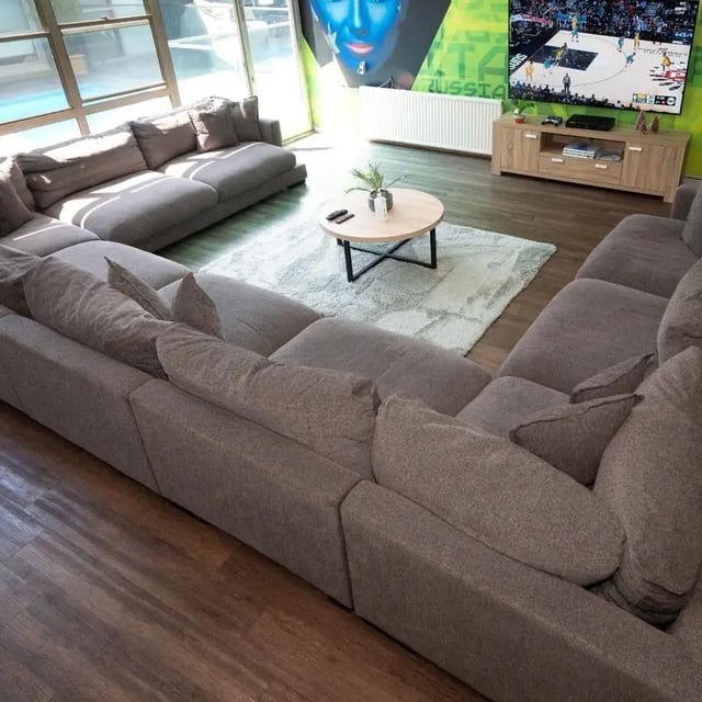 Large sectional sofa coffee table television living room at Sydney Student Living Concord in Sydney Student Accommodation
