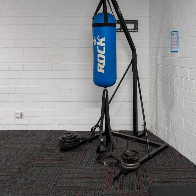 Punching bag stand weights and flooring gym area at Sydney Student Living Concord in Sydney Student Accommodation
