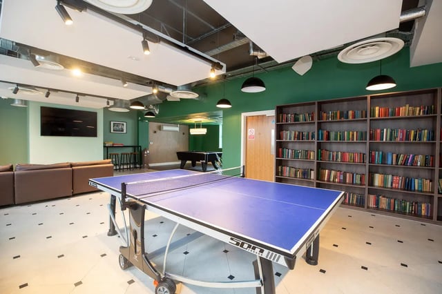 Ping pong table sofa bookshelves and pool table communal area at Collegiate Nova in Nottingham Student Accommodation