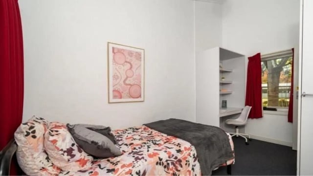 Bed desk and shelf with artwork Bedroom at UniLodge Wodonga East End in Wodonga Student Accommodation