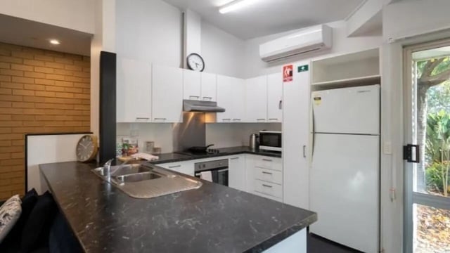 Kitchen counter sink microwave oven fridge kitchen at UniLodge Wodonga East End in Wodonga Student Accommodation