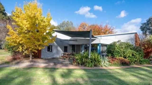Picnic table under shade sail exterior at UniLodge Wodonga East End in Wodonga Student Accommodation
