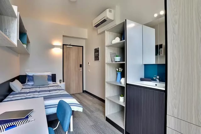 Bed study area with sink and shelving unit room at Scape Adelaide University in Adelaide Student Accommodation
