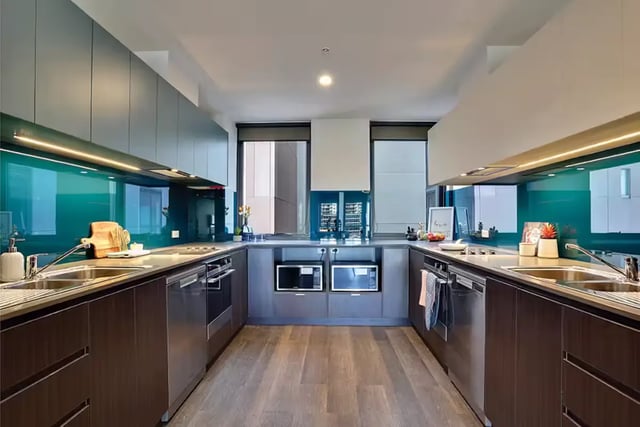 Modern kitchen with dark cabinets stainless steel appliances kitchen at Scape Adelaide University in Adelaide Student Accommodation