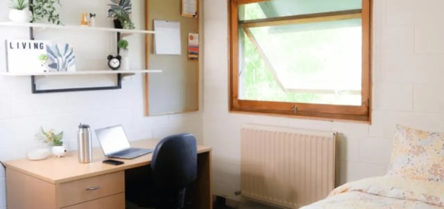 Desk with laptop and chair study bedroom at La Trobe University - Units in Melbourne Student Accommodation