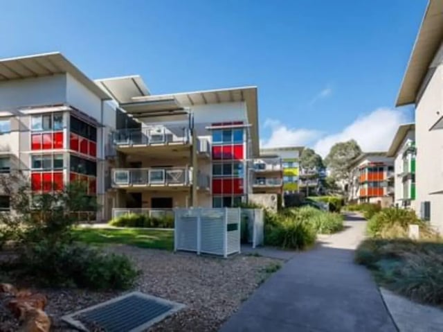 Modern apartments with red balconies and balconies exterior at UniLodge @ UC - Campus West & Guginya in Canberra Student Accommodation