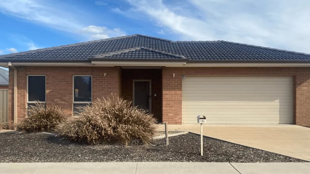 Brick house with garage and landscaping exterior at UniLodge @ UC - Campus West & Guginya in Canberra Student Accommodation