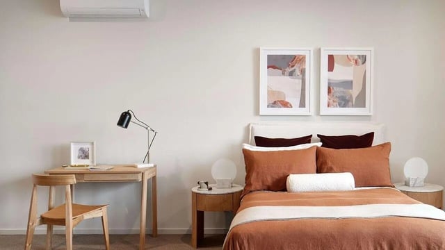 Desk chair lamp framed art and bed bedroom at Realm Caulfield in Melbourne Student Accommodation