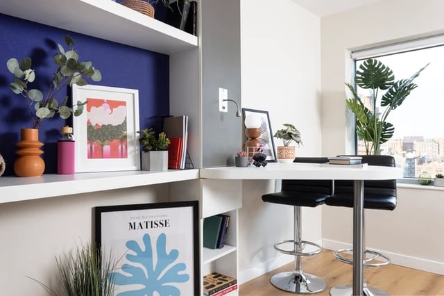Table with stools and plants study area at Bridgewater Heights in Manchester Student Accommodation