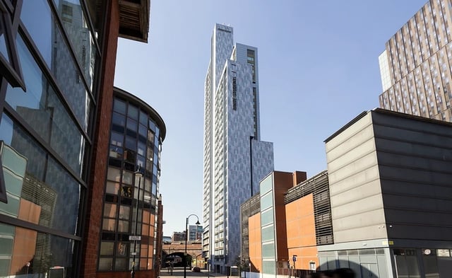 Modern apartment towers reflected in glass exterior exterior at Bridgewater Heights in Manchester Student Accommodation