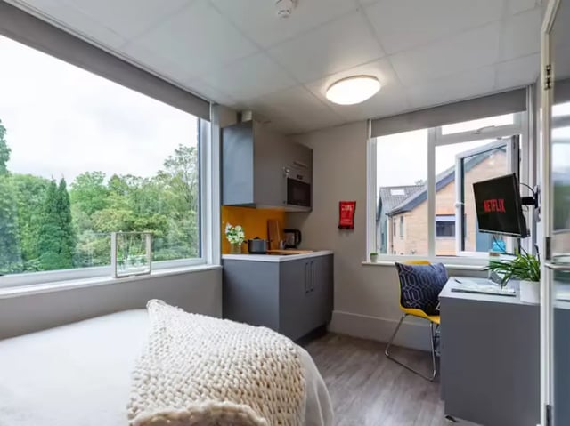 Bed kitchen and desk area studio at Allen Court in Manchester Student Accommodation