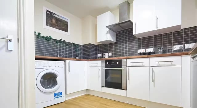 Washer oven cabinets countertops and backsplash Kitchen at Oxney House & Gardens in Manchester Student Accommodation