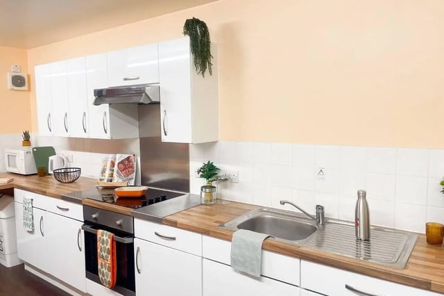 White cabinets oven sink microwave kitchen at Don Gratton House in London Student Accommodation