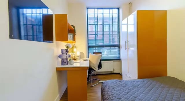 Bed desk wardrobe and window bedroom at Nottingham Square in Nottingham Student Accommodation