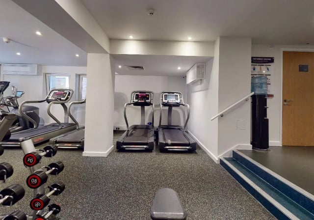 Treadmills dumbbells water cooler gym area at iQ Tufnell House in London Student Accommodation