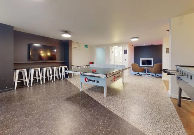 Ping pong table chairs TV lounge area at iQ Tufnell House in London Student Accommodation