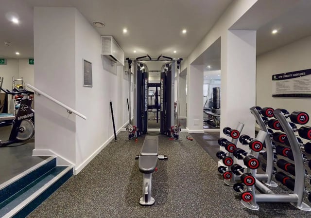 Spinning bike cable machine dumbbells bench gym at iQ Tufnell House in London Student Accommodation