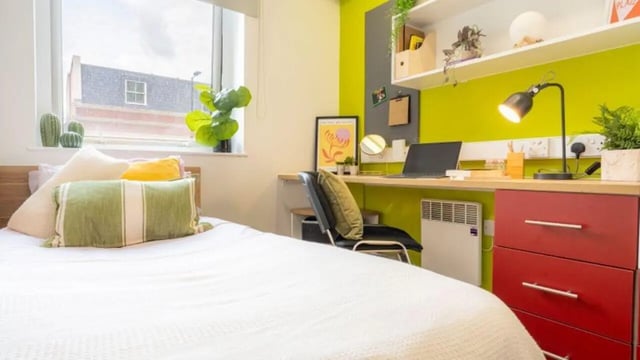 Bed desk and red drawers bedroom study area at iQ The Arcade in London Student Accommodation