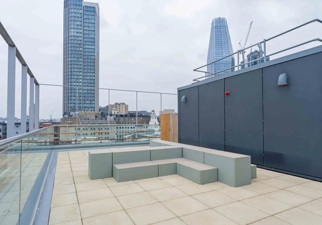 Modern L-shaped bench seating on rooftop patio exterior at iQ Paris Gardens in London Student Accommodation