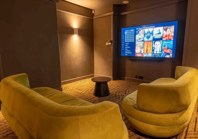 Comfortable sofas and television in entertainment room at iQ Paris Gardens in London Student Accommodation