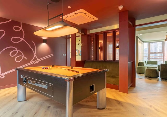 Pool table with balls and cues playing area at iQ Paris Gardens in London Student Accommodation