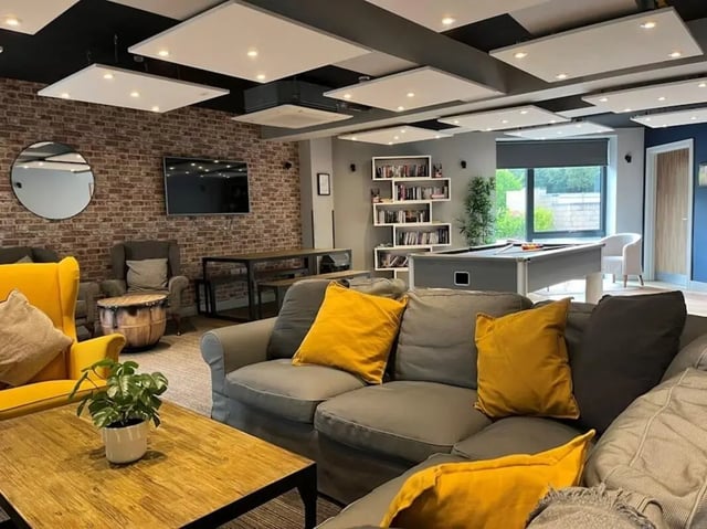 Sofa pool table bookshelves lounge area at Chapel Heights in Durham Student Accommodation