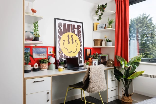 Desk with laptop chair poster and plants Study area at Elvet Studios in Durham Student Accommodation