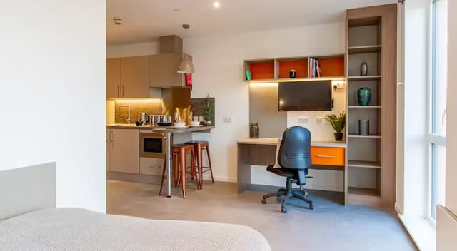 Kitchen area with study desk and bed. at Dean Street Works in Bristol Student Accommodation