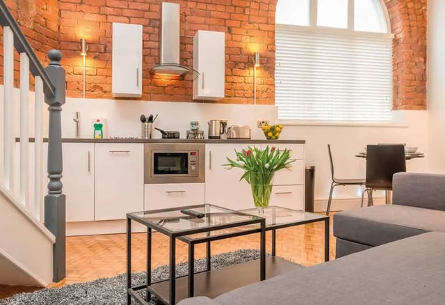 Kitchen with dining area and living room. at Ashton House in Manchester Student Accommodation