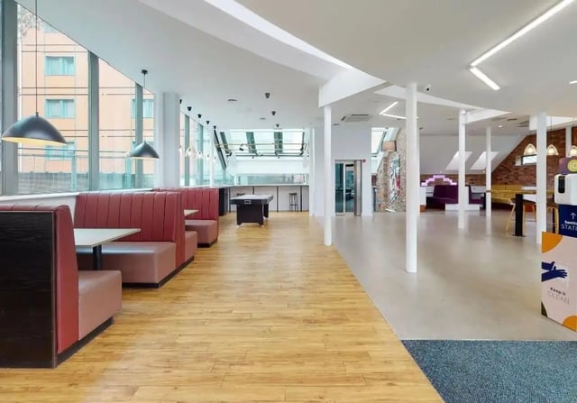 Red booths pool table and tables communal area at iQ Kerria Apartments in Manchester Student Accommodation
