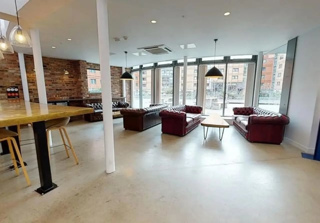 Chesterfield sofas and tables common area living room at iQ Wilmslow Park in Manchester Student Accommodation