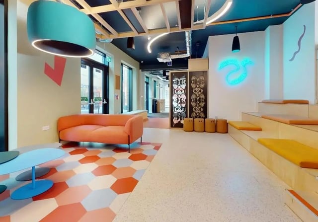 Orange couch tables and seating area common space at iQ Signal Place in Nottingham Student Accommodation