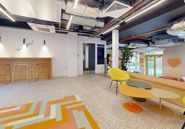 Modern seating area with bar stools and lounge chairs Common Area at iQ Signal Place in Nottingham Student Accommodation