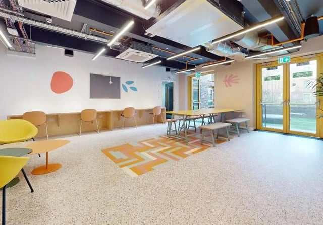 Long table with stools and chairs common area at iQ Signal Place in Nottingham Student Accommodation