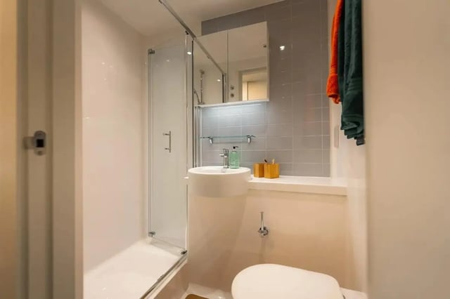 Shower sink toilet with towels bathroom at Redgate in Nottingham Student Accommodation