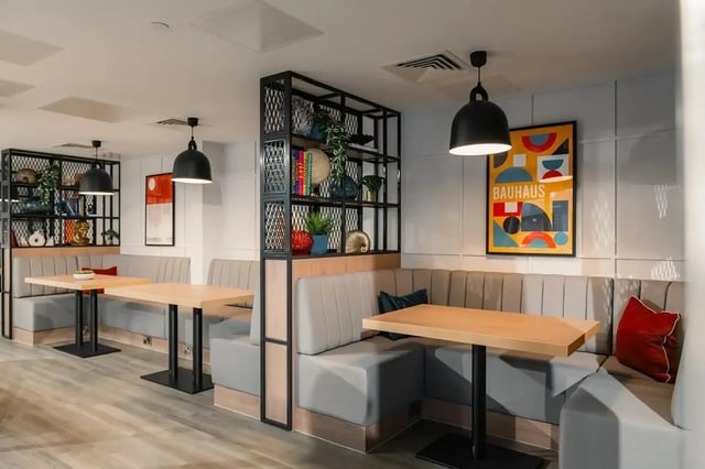Booth seating tables and shelves common area at Redgate in Nottingham Student Accommodation